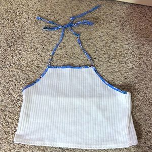 White cropped shirt with blue flowery around the neck strings/sleeves